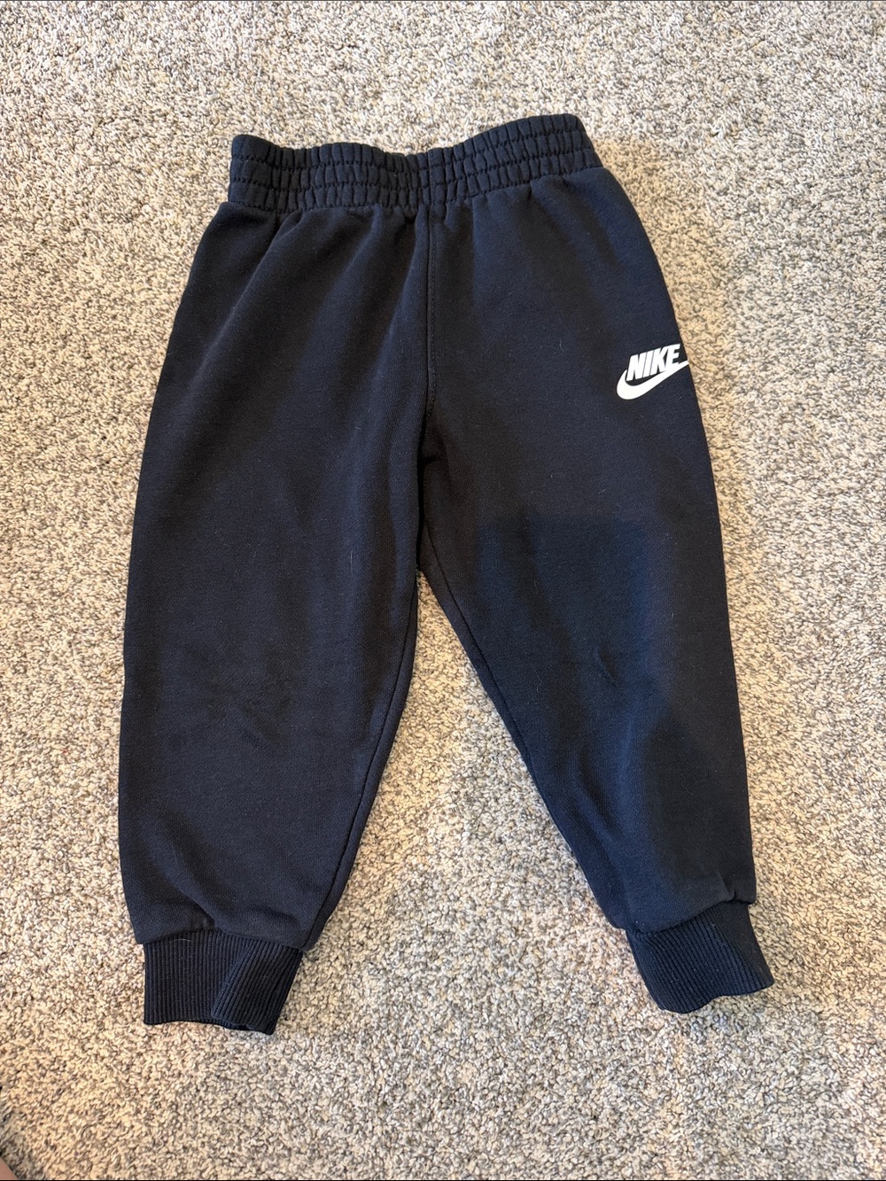 Nike Kids Black Sweatpants with White Swoosh